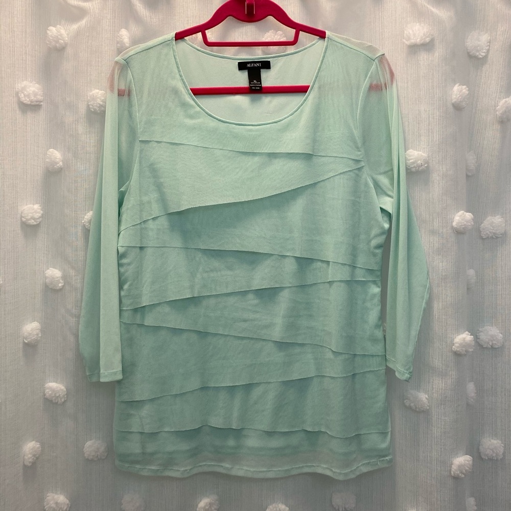 Baby green long sleeve tee. Sleeves are nylon